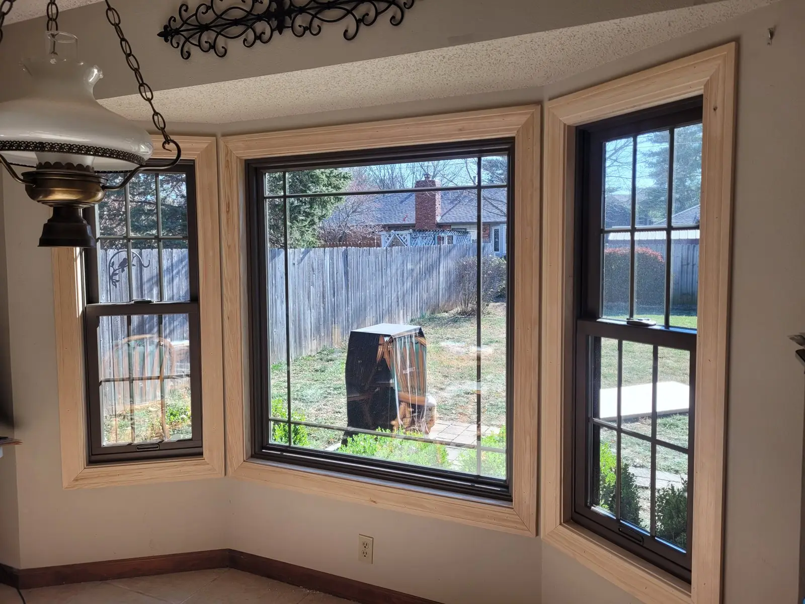 Bay window with new trim above a kitchen counter