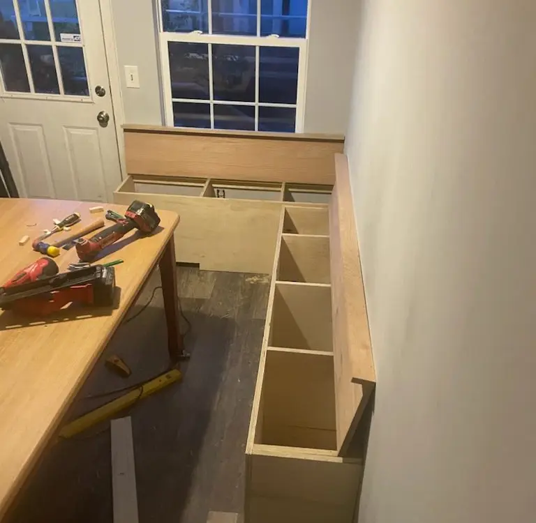 Built-in cabinet boxes under construction with tools on the counter