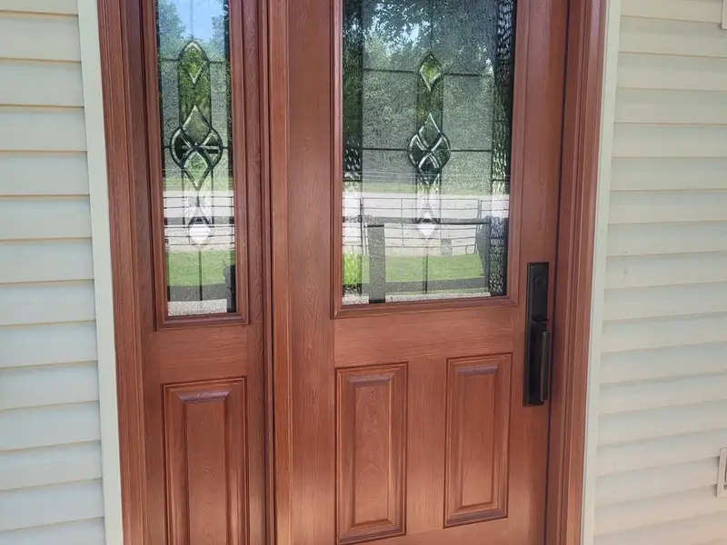 New wood entry door with glass, installed on a Springfield home