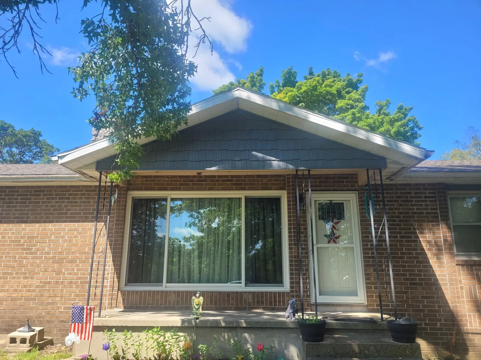 Front of a home with new windows, siding, and trim
