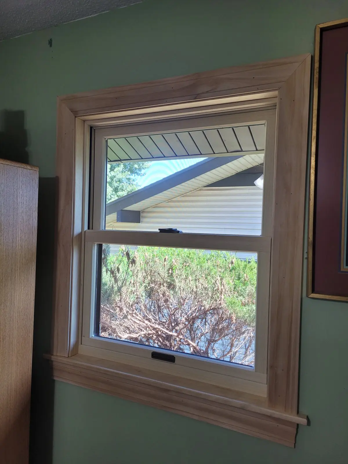 Exterior window with new wood trim